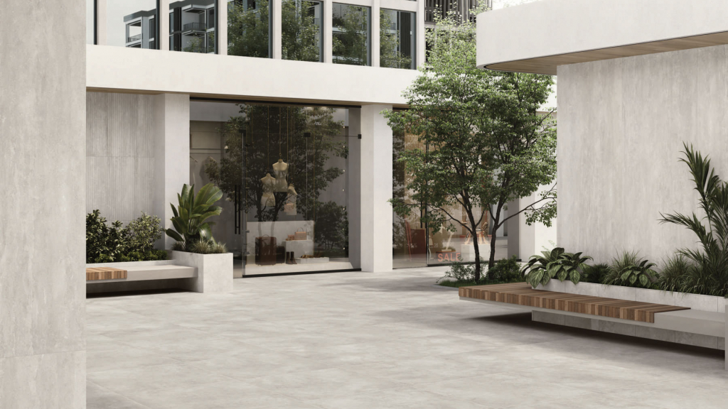 Side-by-side Caesar Civic concrete-effect and Prima clay-effect porcelain tiles texture comparison for Dubai commercial interior design